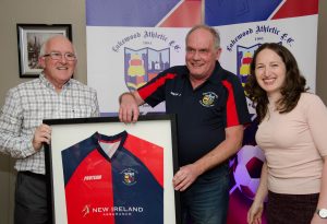 Ger Cahill being presented with a framed jersey by Lakewood Athletic Chairman Joe Dillion and Schoolgirls Aoife Kelliher. Presented for his outstanding vision, dedication and commitment to Lakewood Athletic FC